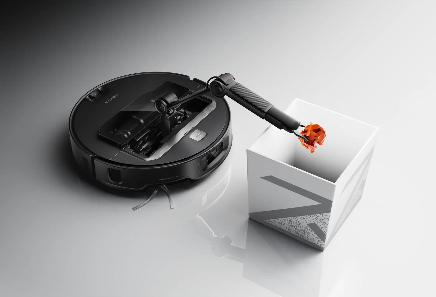 A Roborock Saros Z70 robot vacuum using its small mechanical arm to move an object